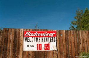 Sign advertising special on beer to hunters.