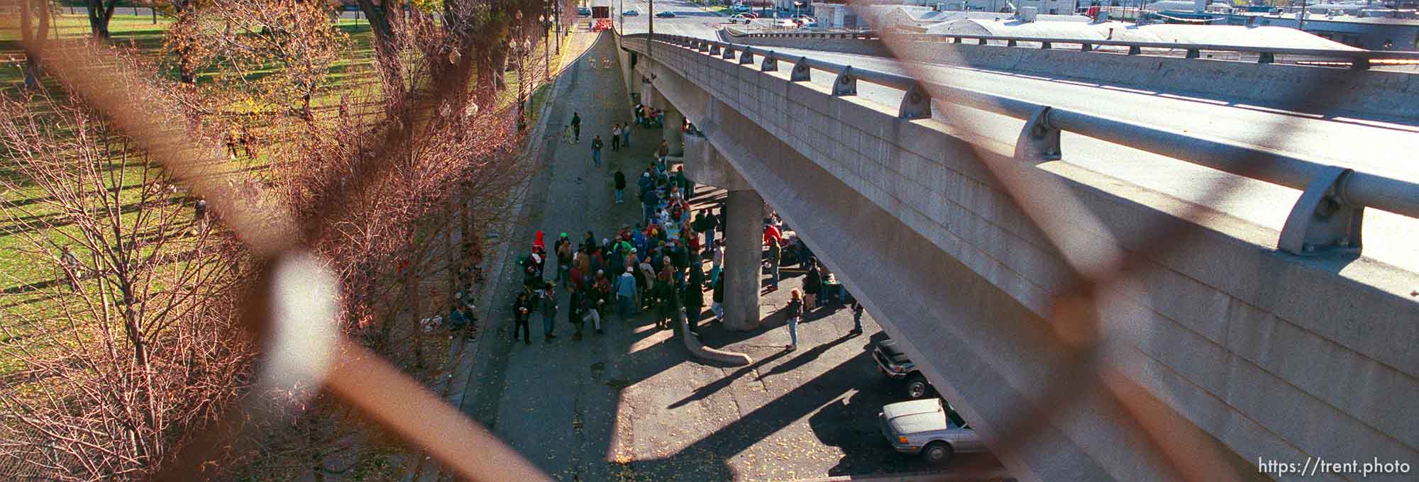 The last Sunday morning breakfast served to the homeless by volunteers under the 400 South viaduct. The viaduct will be torn down as part of the massive freeway construction project.