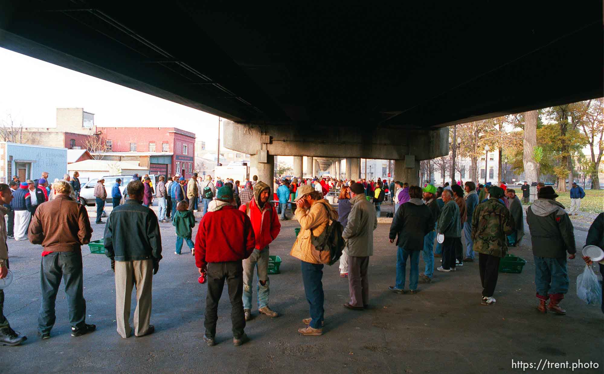 The last Sunday morning breakfast served to the homeless by volunteers under the 400 South viaduct. The viaduct will be torn down as part of the massive freeway construction project.