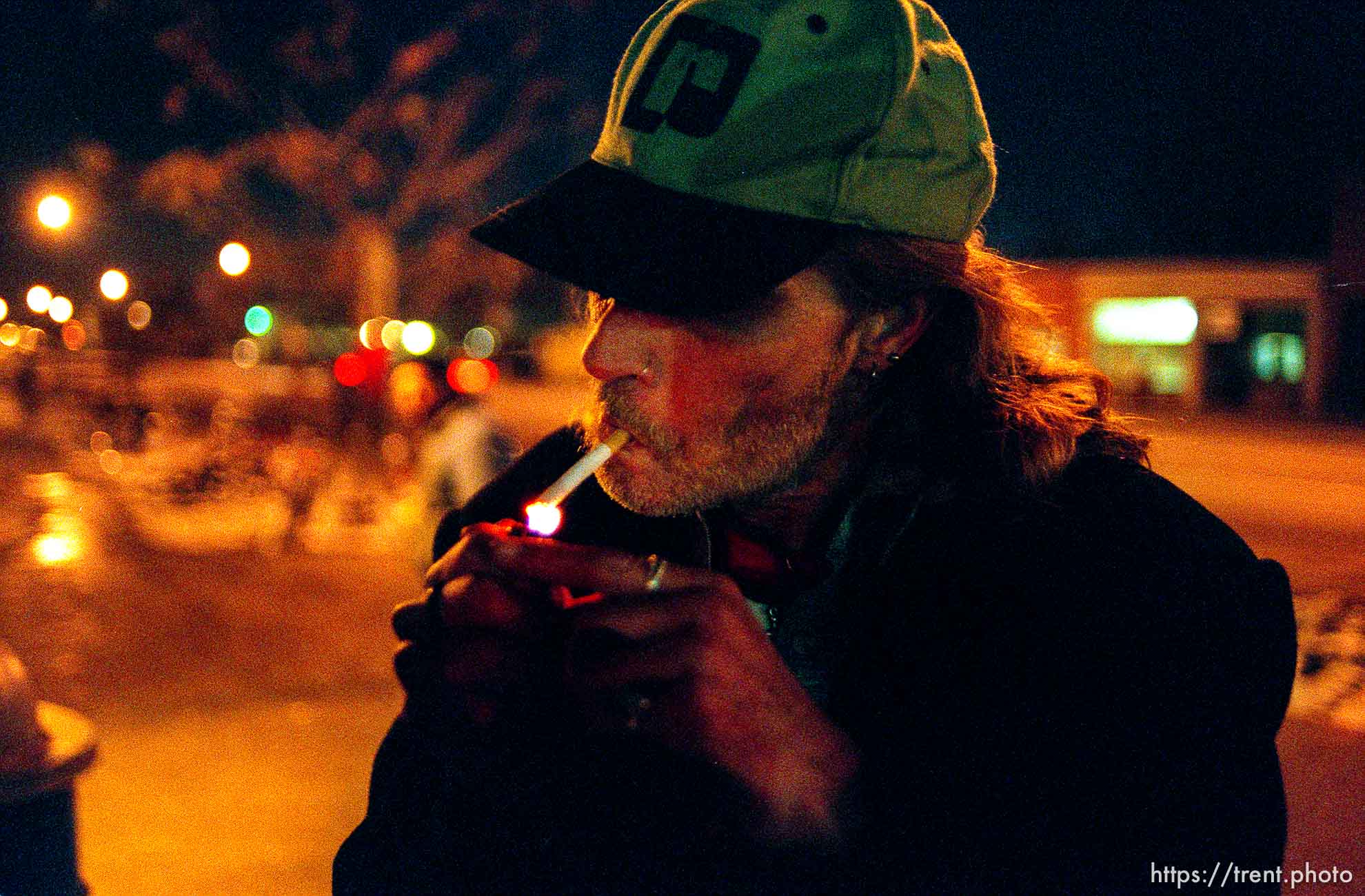 Robert William Smith, homeless in Salt Lake City, lights up a cigarette.