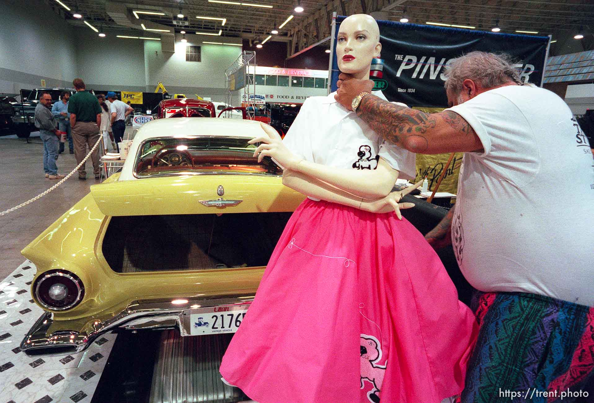 Don Brouse sets up a mannequin next to his '57 Thunderbird at the 24th annual Parts Plus Autorama, held at the Salt Palace Convention Center.