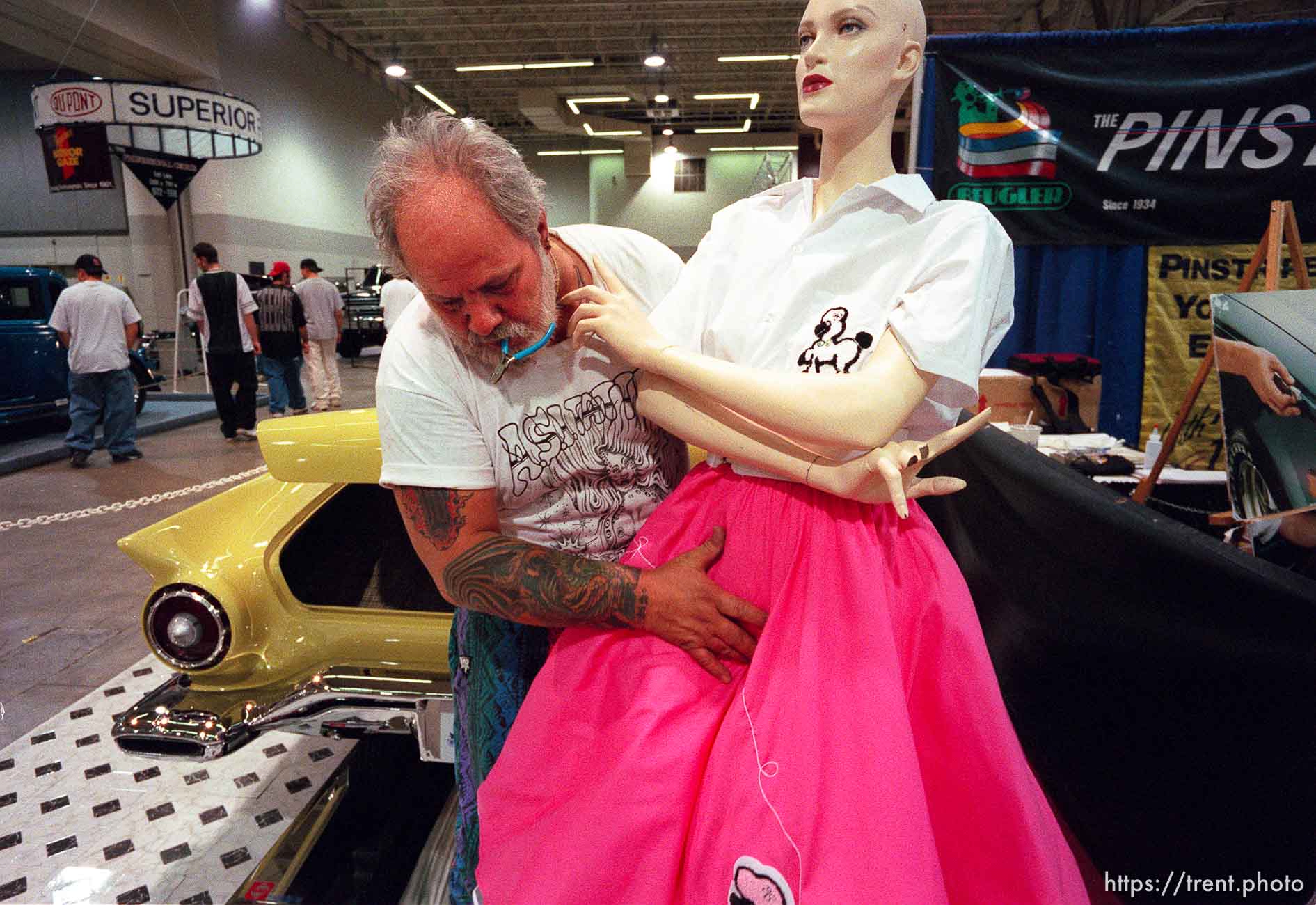 Don Brouse sets up a mannequin next to his '57 Thunderbird at the 24th annual Parts Plus Autorama, held at the Salt Palace Convention Center.