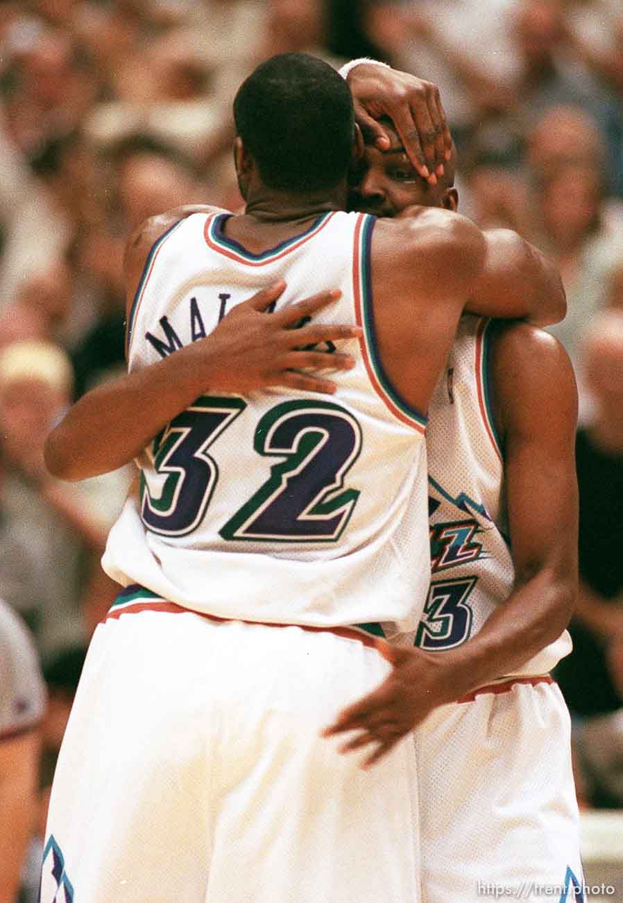 Utah's Karl Malone and Bryon Russell embrace near the end of Utah Jazz vs. Houston Rockets, game 5 of the 1st round, NBA Playoffs. Jazz won.