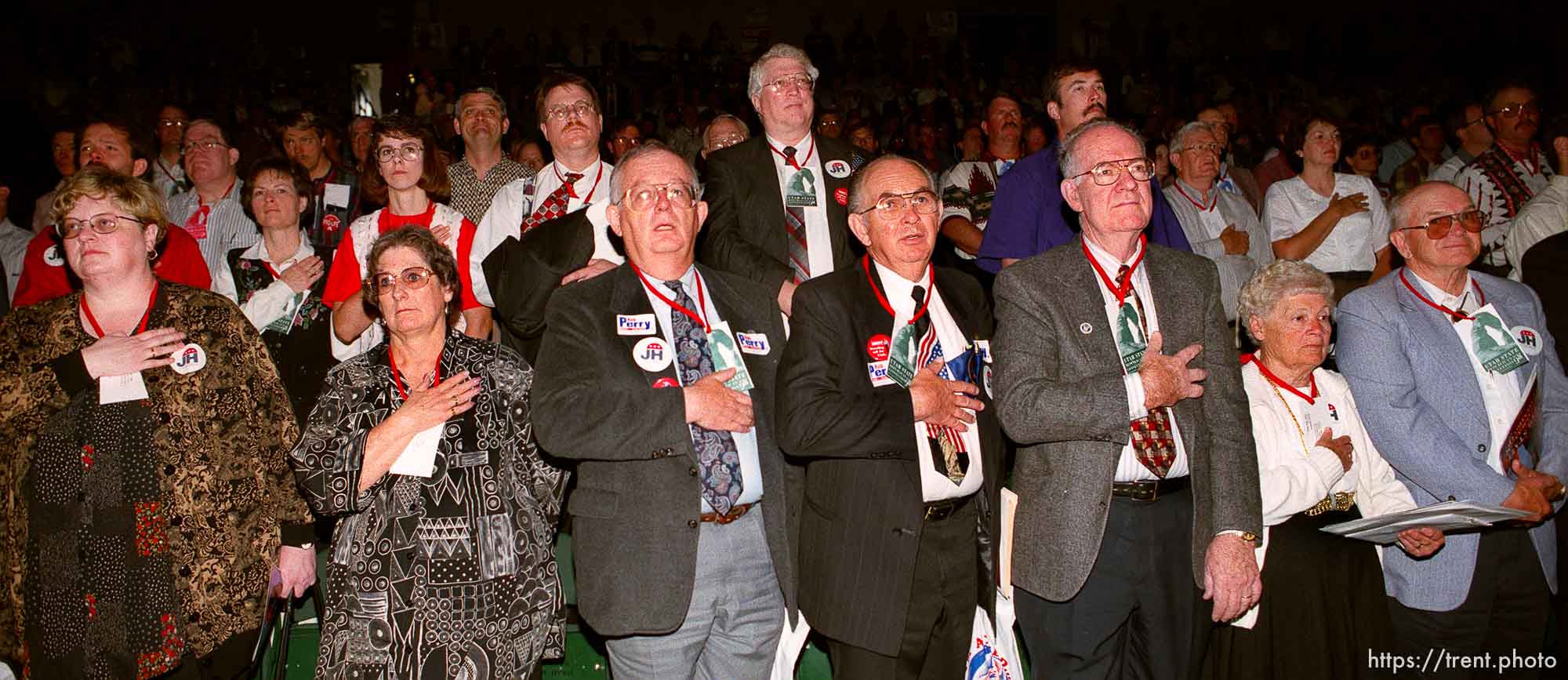 Republicans put their hands over their hearts while the national anthem plays at the Utah State Republican Party Convention, held at Utah Valley State College.