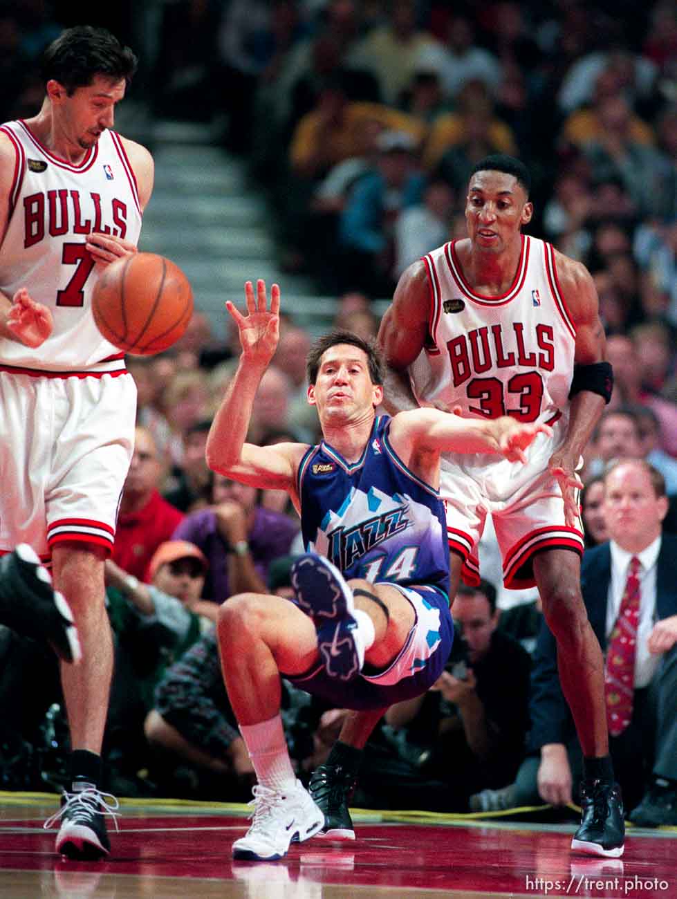 Jeff Hornacek falls down at Jazz vs. Bulls, game 5 of the NBA Finals. Jazz won. Toni Kukoc, Scottie Pippen defend.