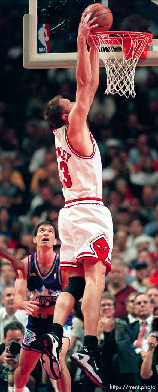 Luc Longley dunks over John Stockton at Jazz vs. Bulls, game 5 of the NBA Finals. Jazz won