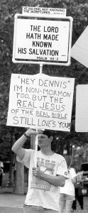 John Sinner holds a Christian sign before Jazz vs. Bulls game 1, NBA Finals. Jazz won.