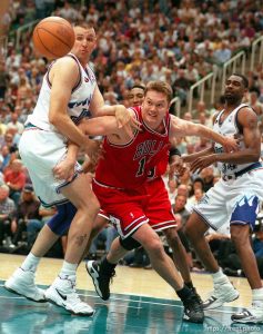 Greg Ostertag and Luc Longley head for a loose ball at Jazz vs. Bulls, game 1 of the NBA Finals. Jazz won