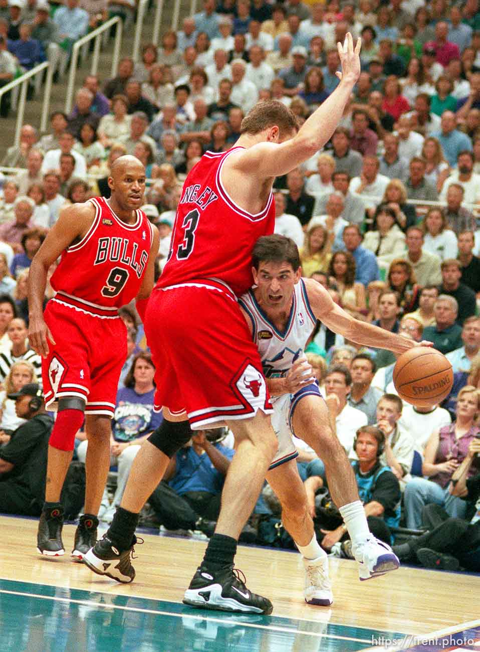 John Stockton drives around Luc Longley at Jazz vs. Bulls, game 1 of the NBA Finals. Jazz won