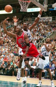 Michael Jordan shoots over Karl Malone at Jazz vs. Bulls, game 1 of the NBA Finals. Jazz won