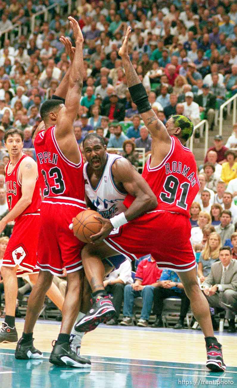 Karl Malone drives between Scottie Pippen and Dennis Rodman at Jazz vs. Bulls game 2, NBA Finals. Bulls won.