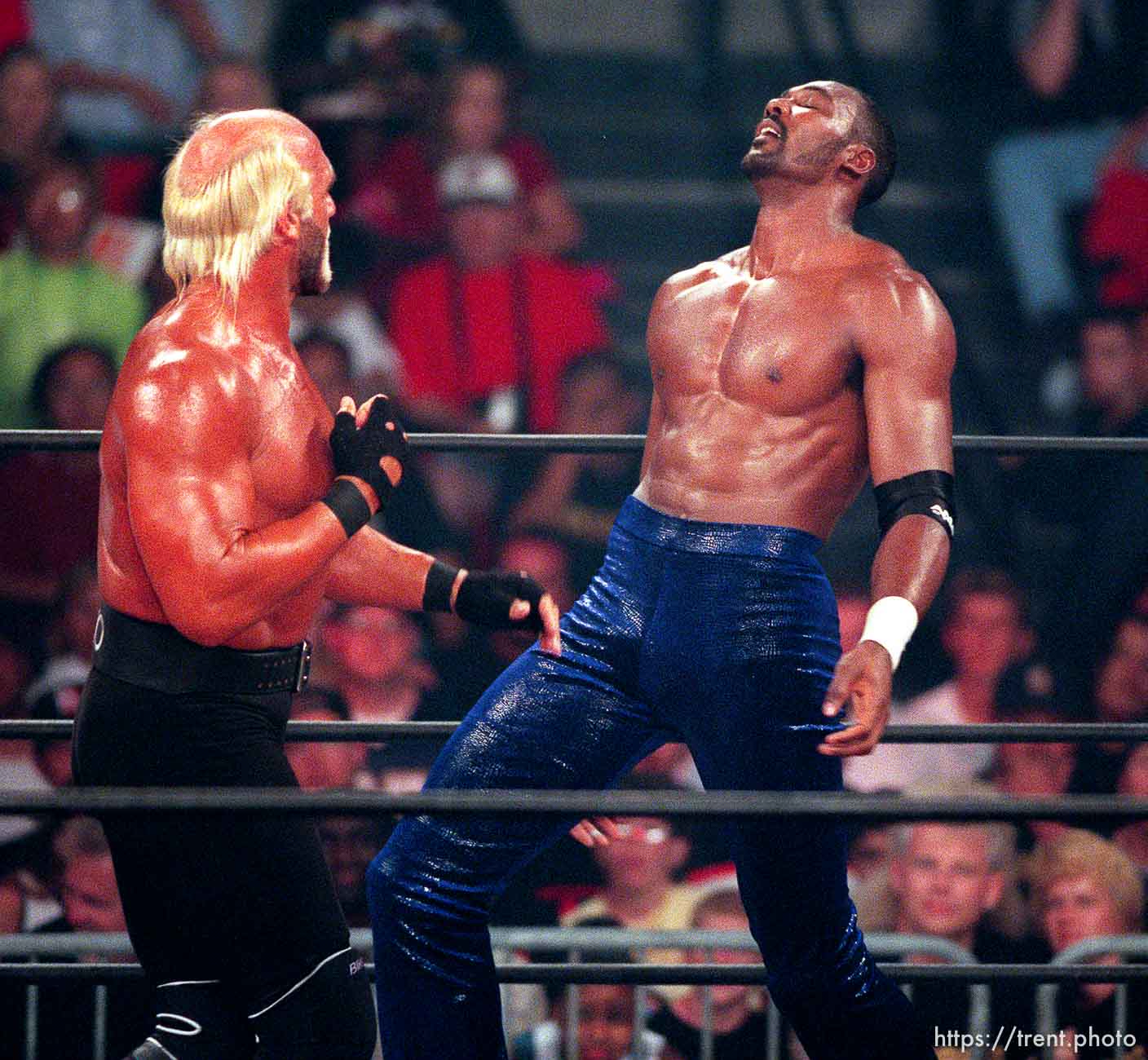 Karl Malone and Hollywood Hulk Hogan wrestle at WCW's Bash at the Beach.