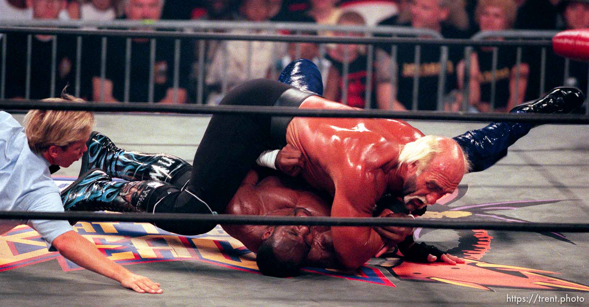 Karl Malone and Hollywood Hulk Hogan wrestle at WCW's Bash at the Beach.