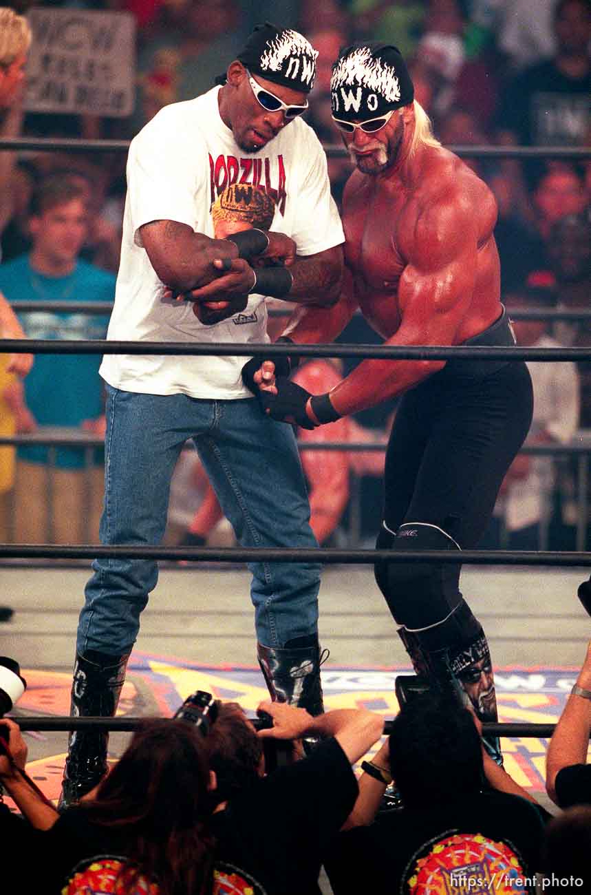 Dennis Rodman and Hollywood Hulk Hogan flex for the cameras at WCW's Bash at the Beach.