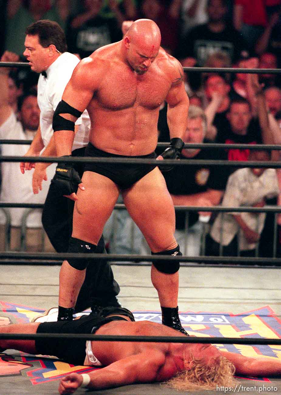 Goldberg looks down at defeated Curt Hennig at WCW's Bash at the Beach.