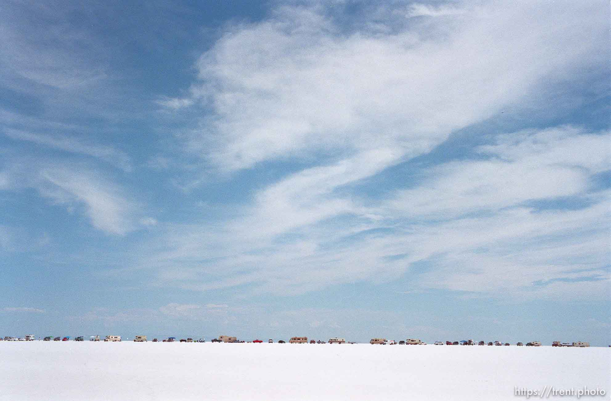 Cars and RV's lined up at the Bonneville Salt Flats to watch Speed Week.