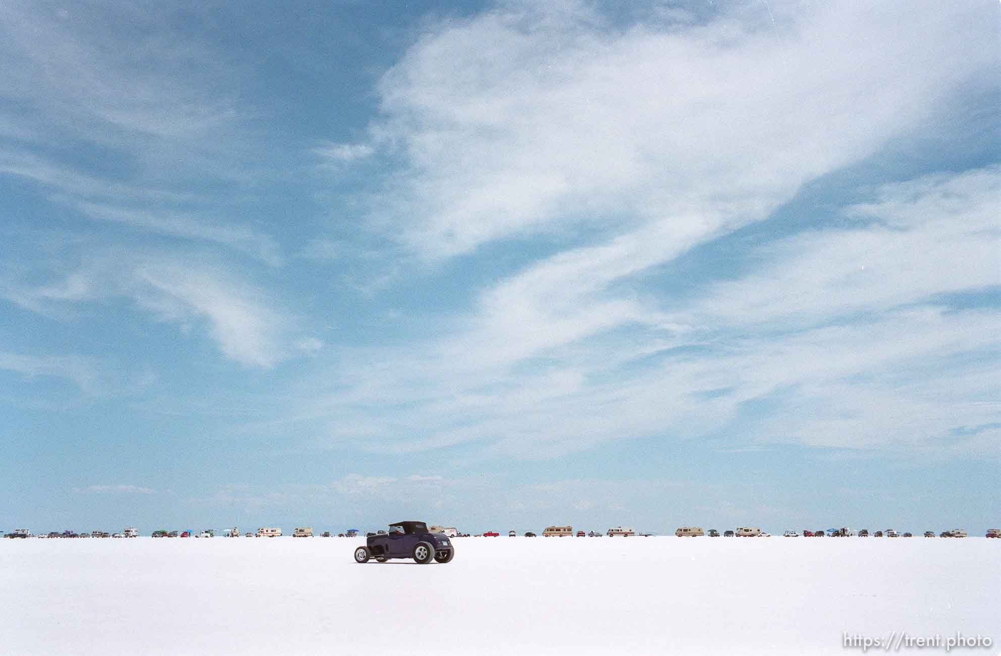 Cars and RV's lined up at the Bonneville Salt Flats to watch Speed Week.