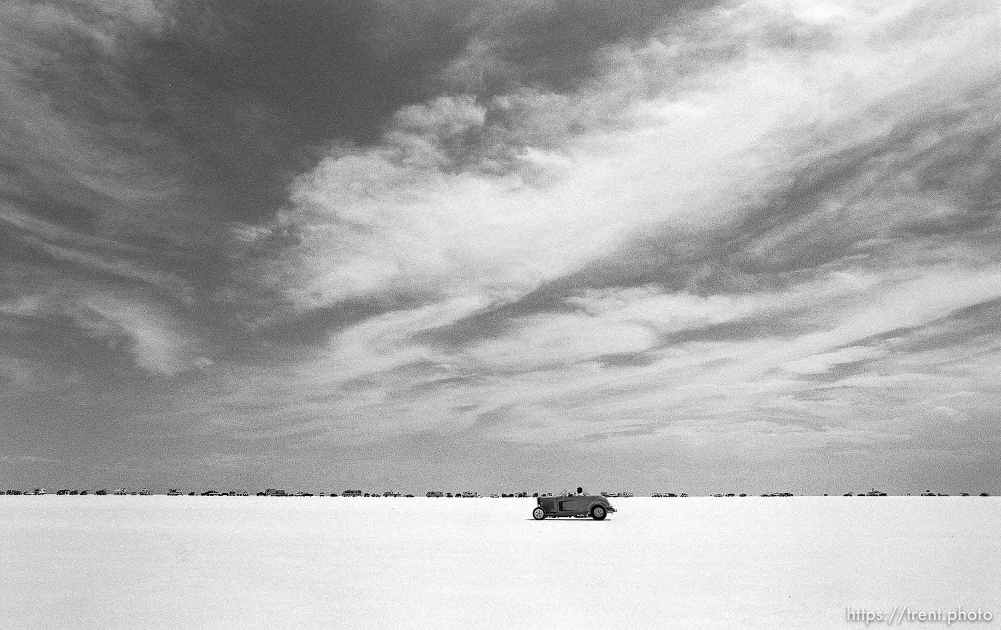 Cars and RV's lined up at the Bonneville Salt Flats to watch Speed Week.