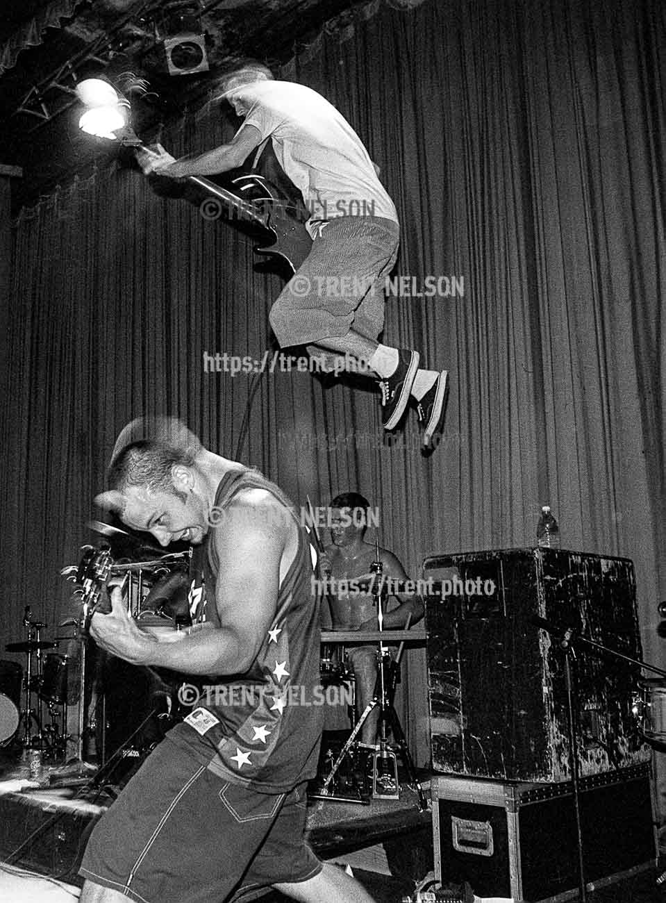 Bass player jumps from amp at Grimlock at the Tower Theater.