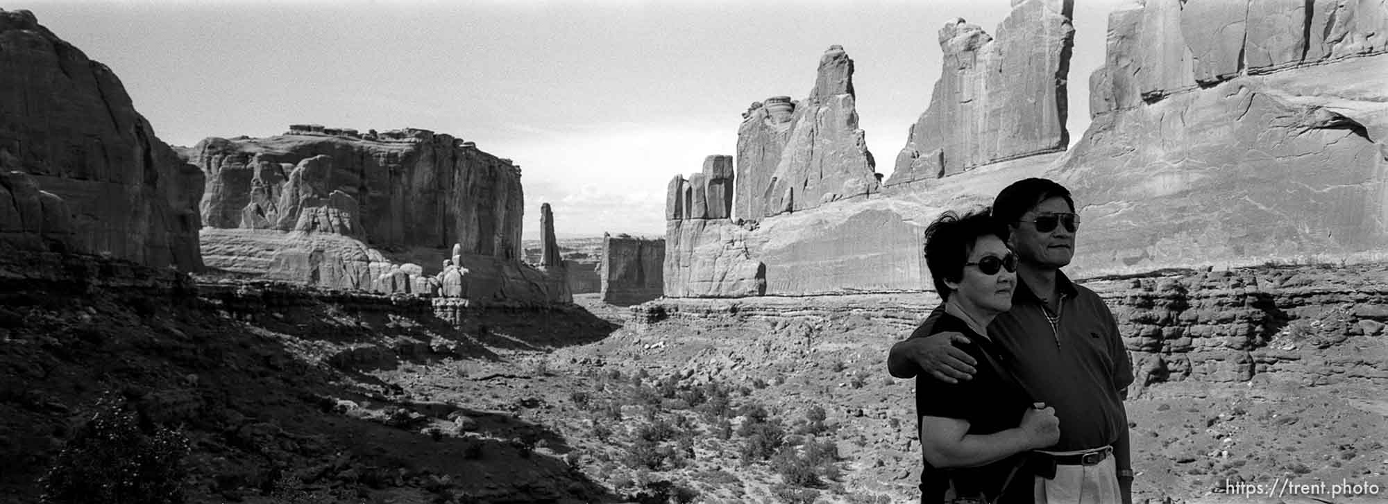 Tourists posing at South Park Avenue at Arches National Park.