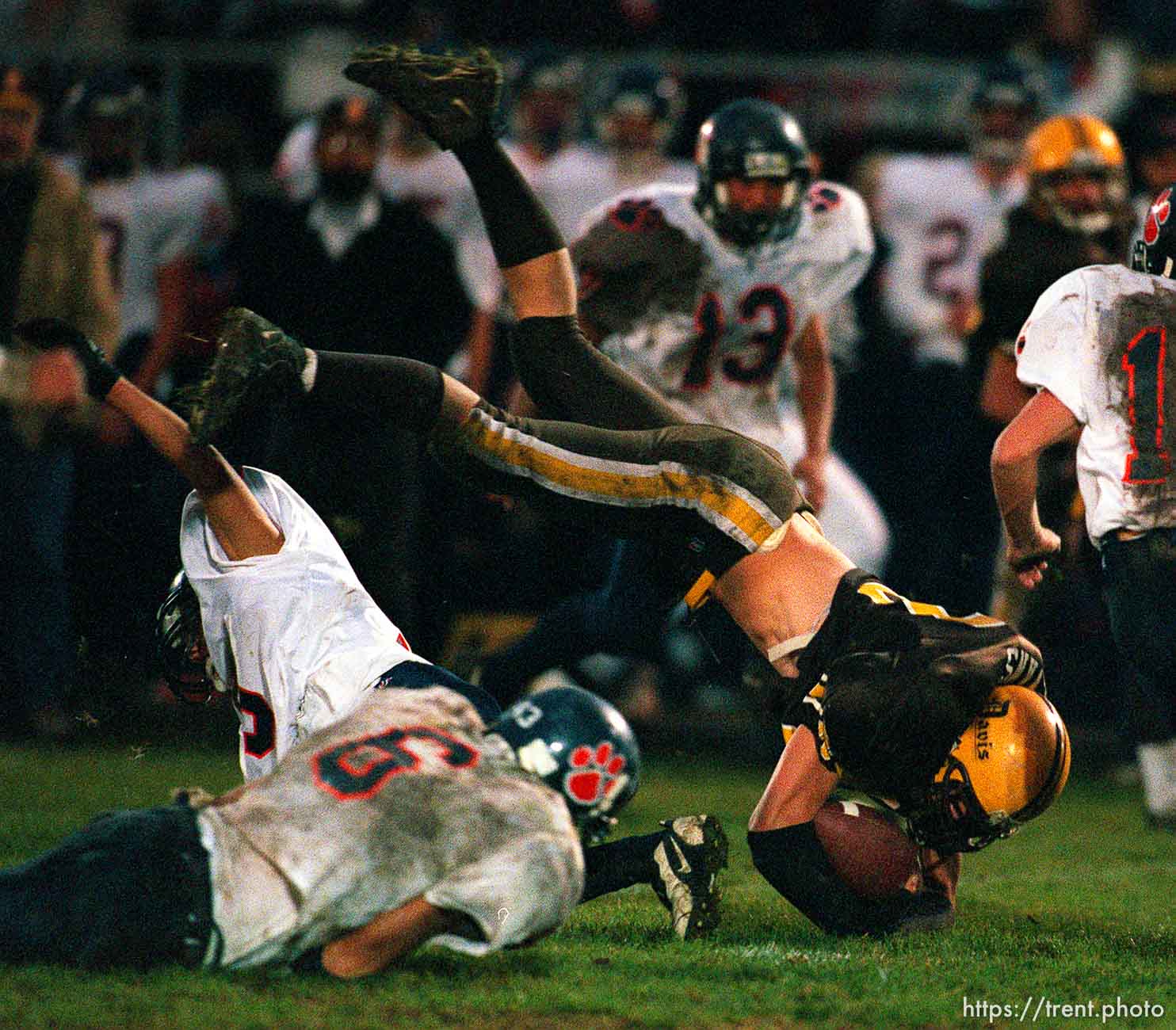 Davis's Jeremy Evans is tripped up at Brighton vs. Davis football playoffs game. Davis won.