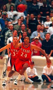 Andre Miller chases a loose ball at Utah vs. Utah State.