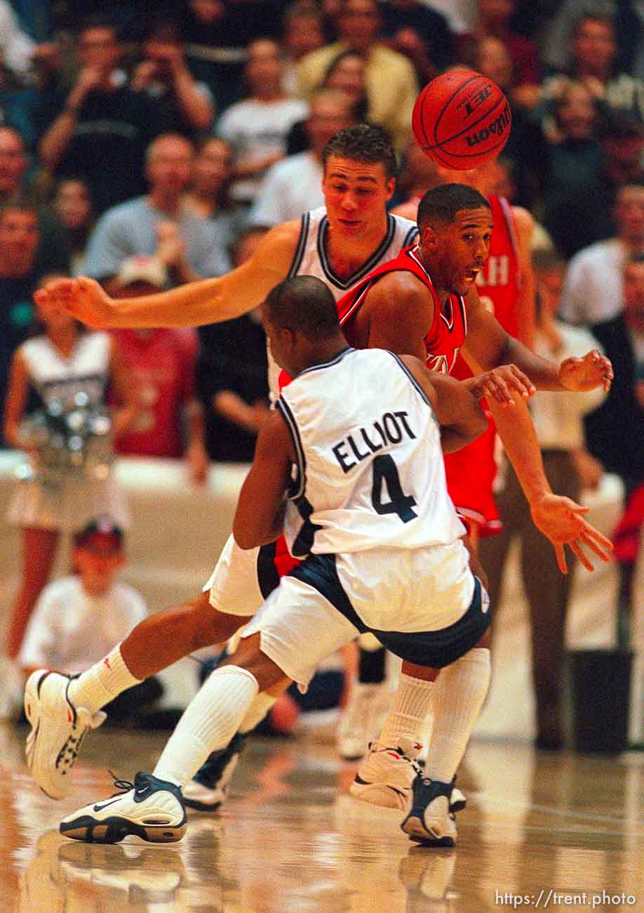 Andre Miller loses the ball as he's fouled by Rashad Elliott at Utah vs. Utah State.