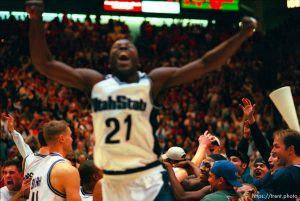 Utah State's Tyrone Allick celebrates Utah State's win over 9th ranked Utah at Utah vs. Utah State.