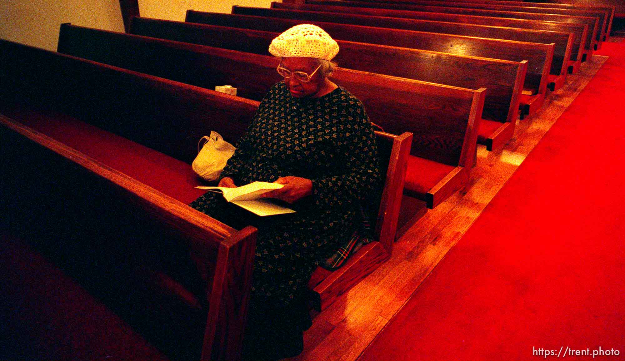 Esther Williams sits in the second row at the Calvary Baptist Church prior to the beginning of the 106th Anniversary and Revival.