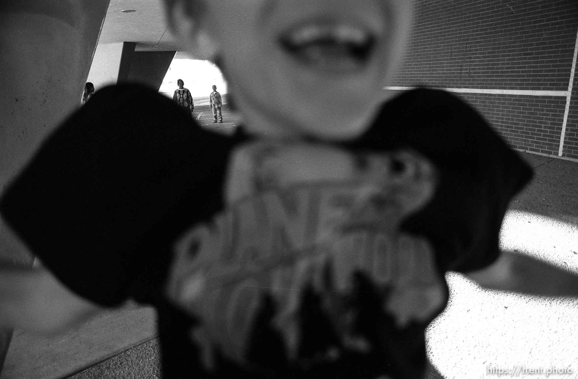 Kid (Grant Hedding) jumps in front of my camera while shooting the after-school care program at Dee Elementary School.