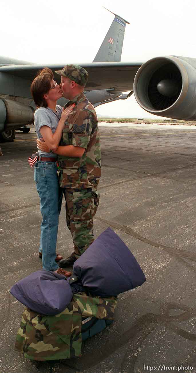 Heidi Fowler embraces her husband Jeff, who returned today from a month-long stint in Kosovo as part of an Air National Guard refueling mission.