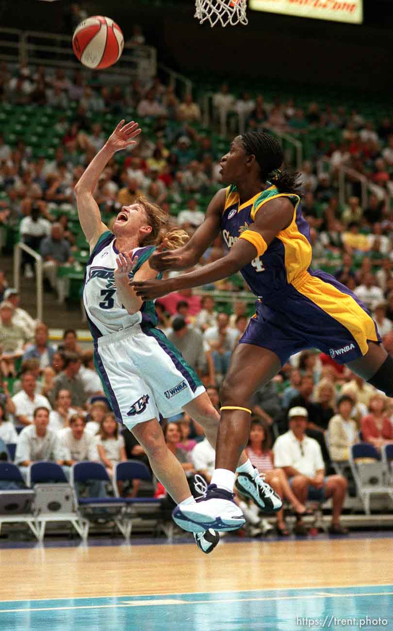 Debbie Black of the Utah Starzz puts up a layup in action vs. the Los Angeles Sparks. Mwadi Mabika is the defender (at right)