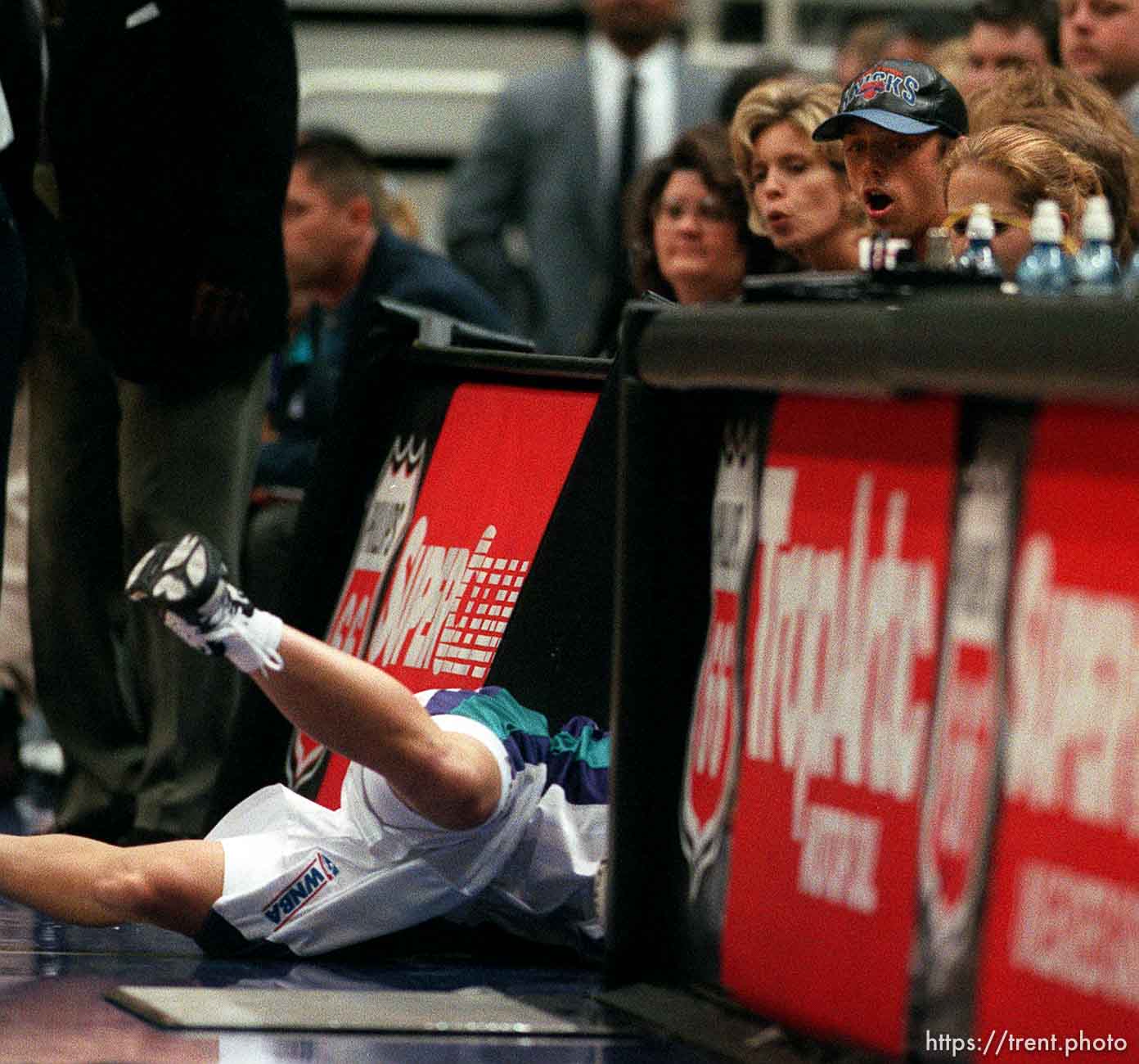 Starzz coach Fred Williams runs over to check on guard Debbie Black after she dove through the scorer's table chasing a loose ball vs. the Los Angeles Sparks. Black was unhurt.