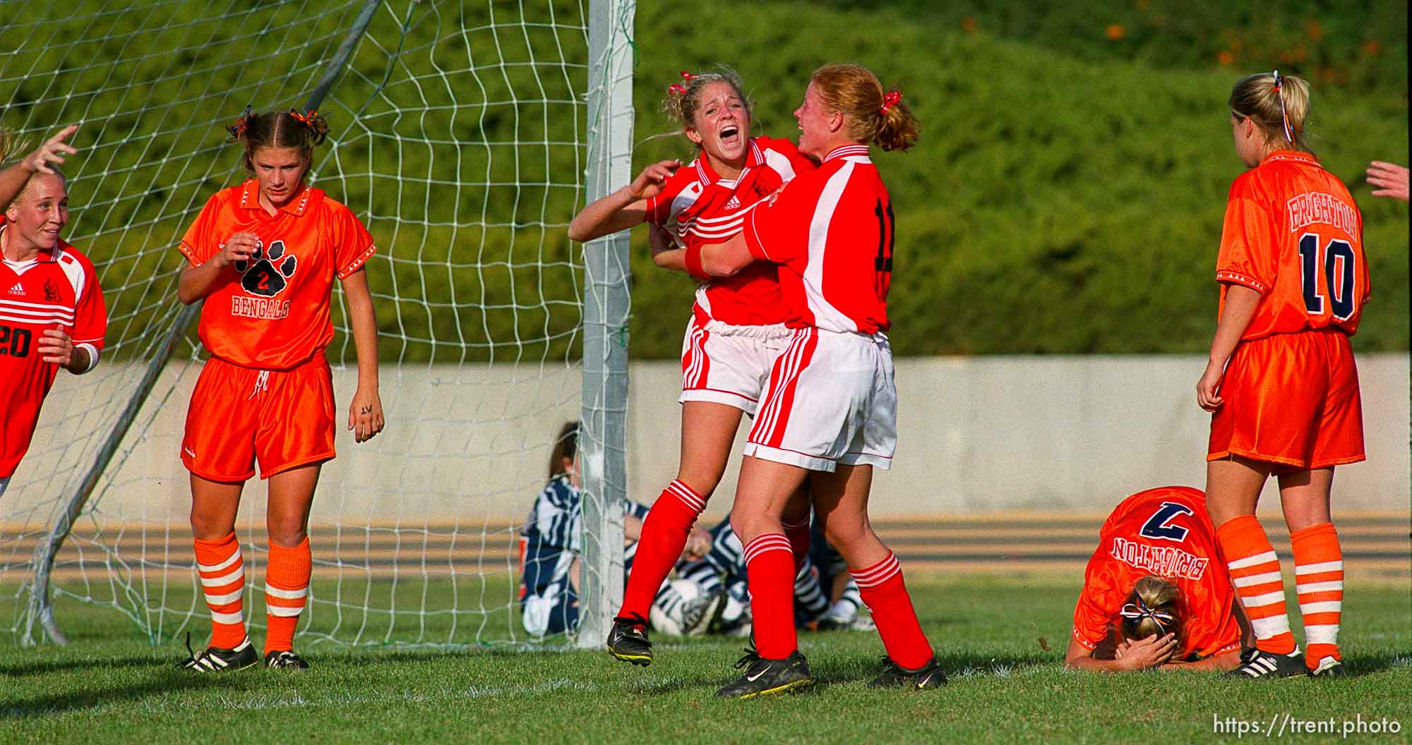 Alta's Annie Payne (left) and Karen Hymer celebrate Payne's goal that brought Alta the 5A State Soccer Championship over Brighton. Brighton players in grief are Emily Ford (#7) and Kristel Despain. Alta beats Brighton for 5A State Soccer Championship.