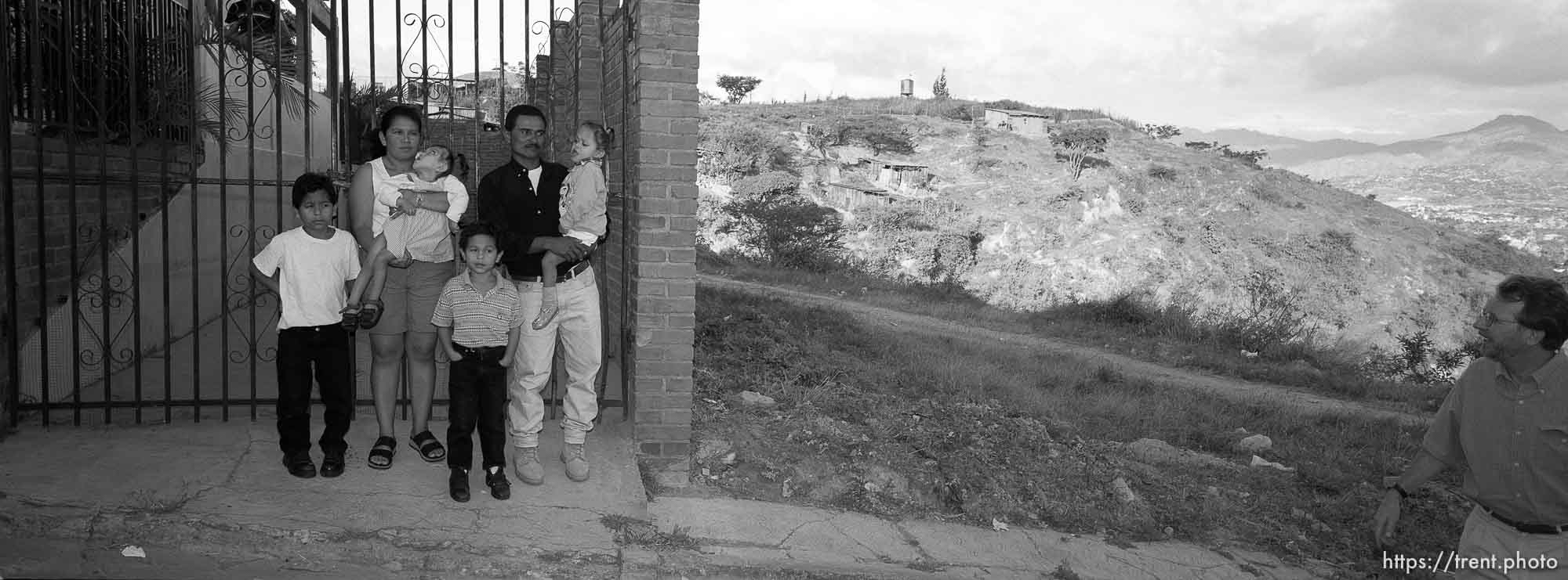 Gonzales family portrait and Jim Woolf at far right. Formerly conjoined twins, Bessy and Doris Gonzales.