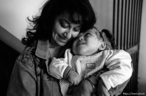 Lilia de Larios holds Bessy Formerly conjoined twins, Bessy and Doris Gonzales.