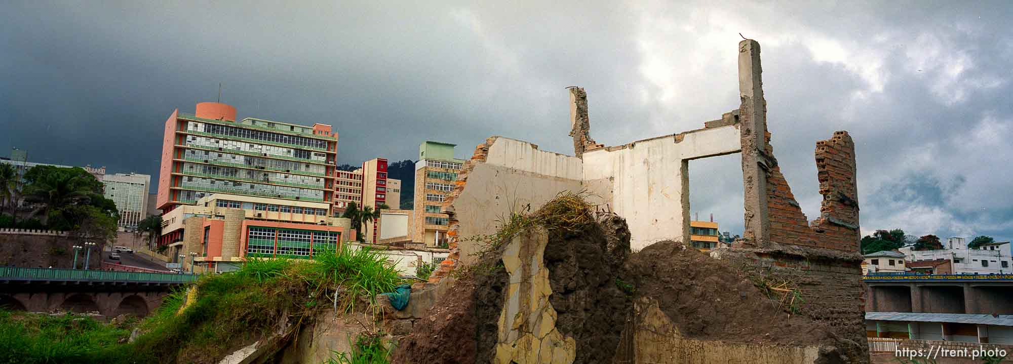 Street scene of damaged buildings from Hurricane Mitch.