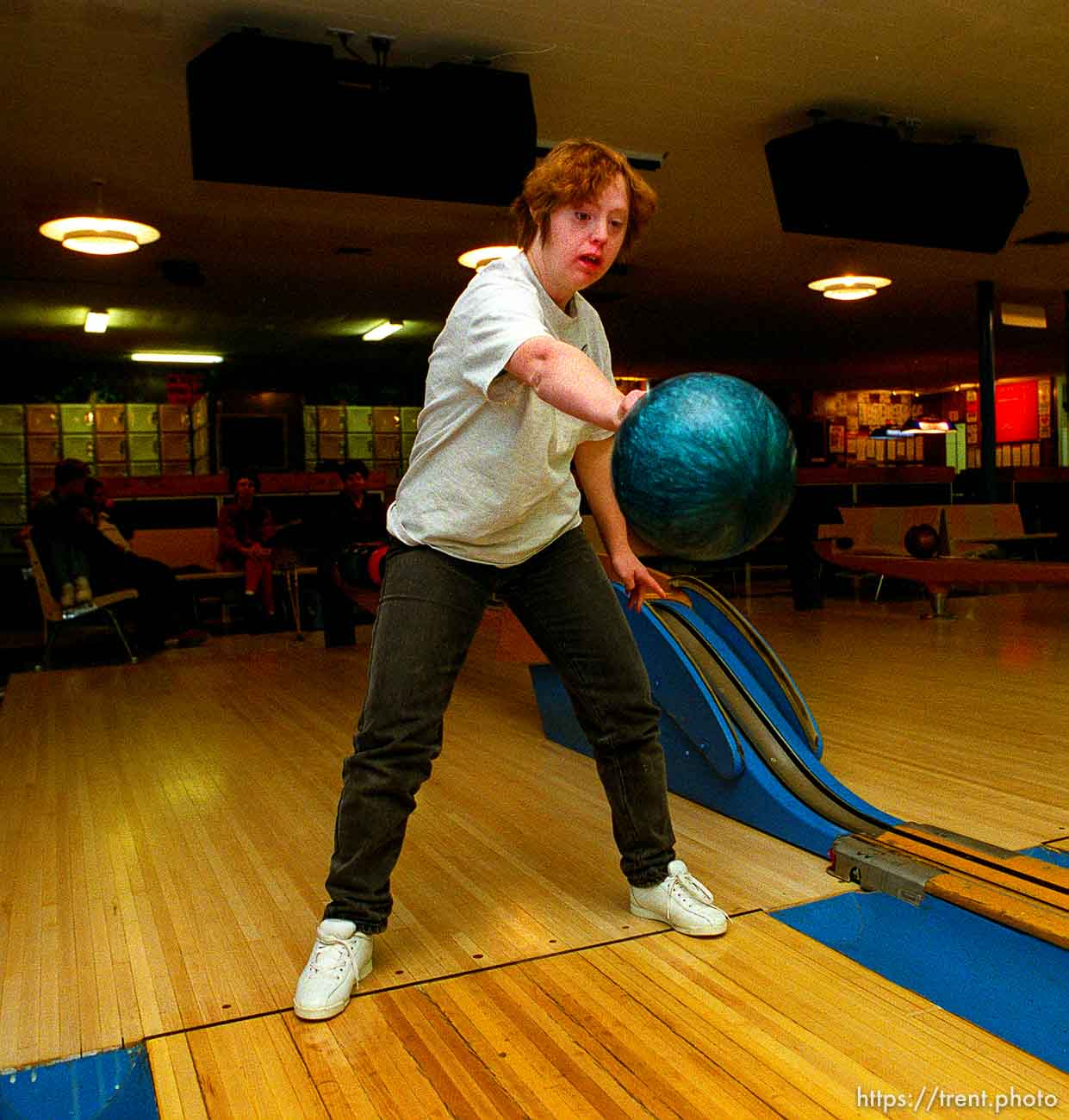 Disabled kids bowling and playing videogames.