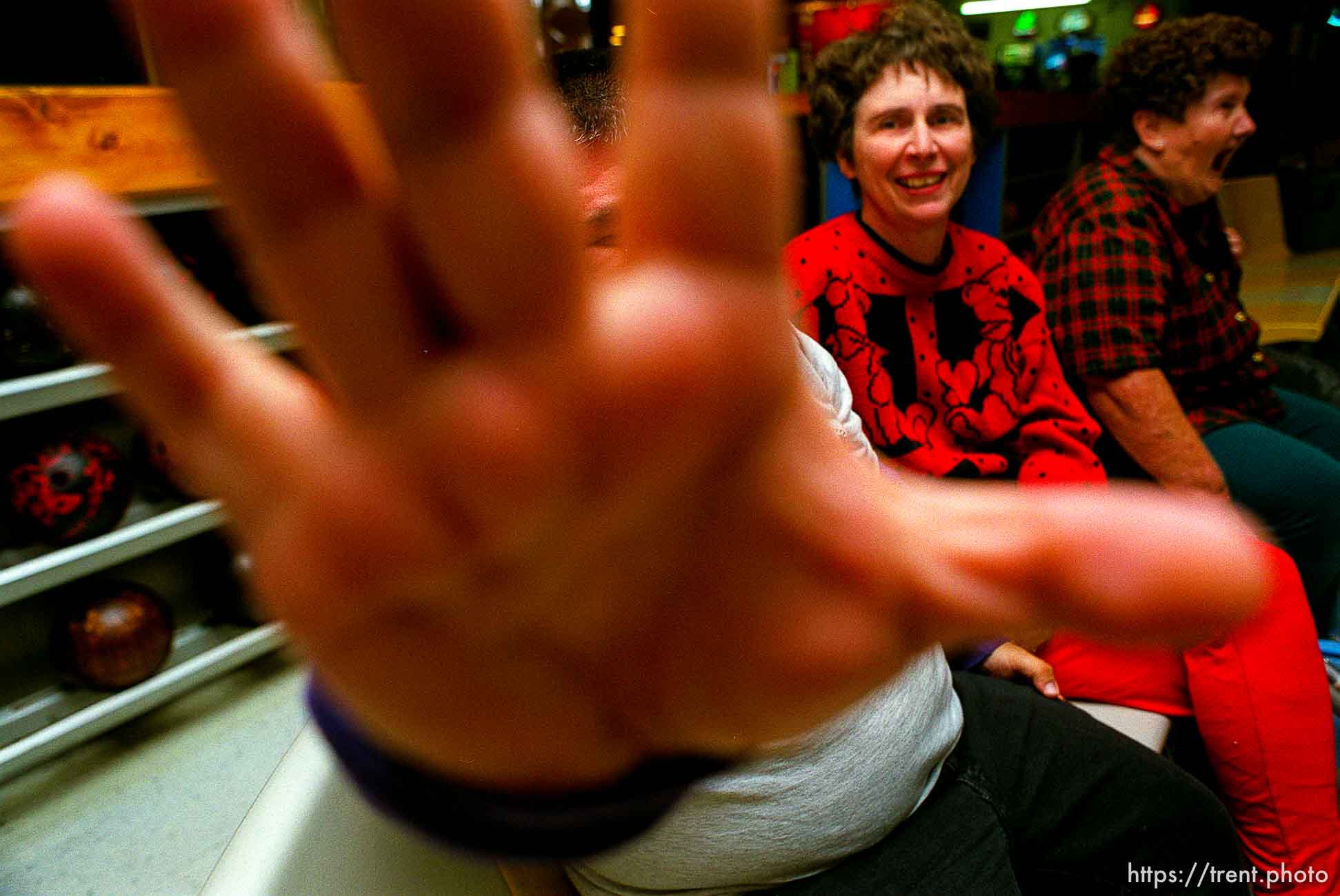 Disabled kids bowling and playing videogames. Guy blocks camera