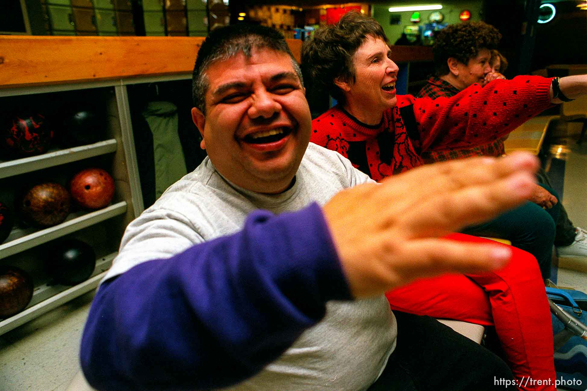 Disabled kids bowling and playing videogames.