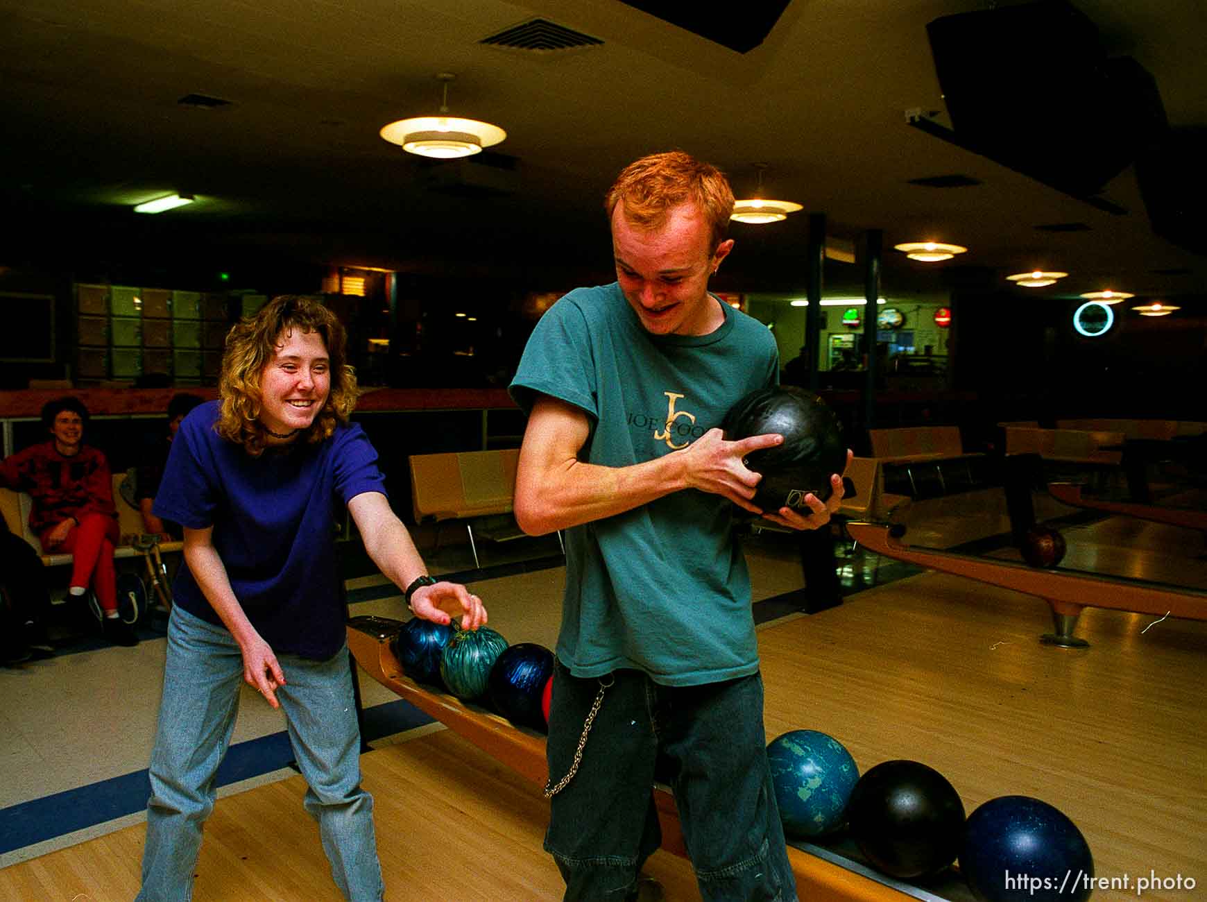 Disabled kids bowling and playing videogames.