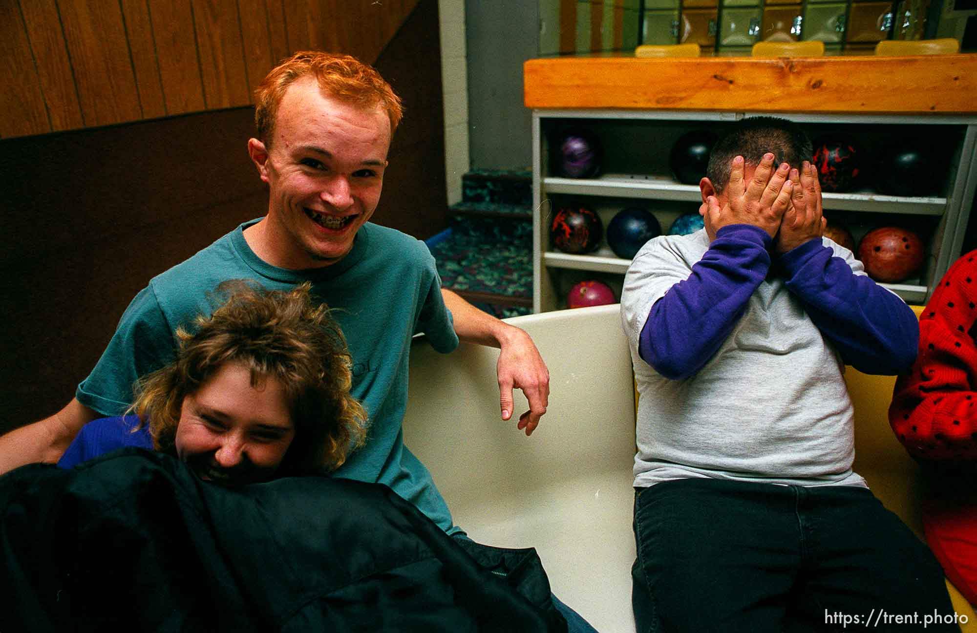 Disabled kids bowling and playing videogames.