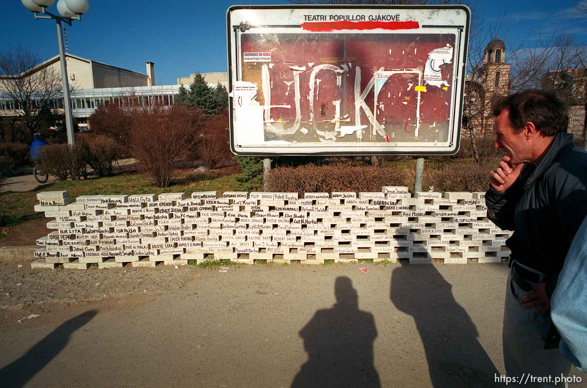 Bricks with the names of missing men from Djakovica. Also, UCK (KLA) on sign