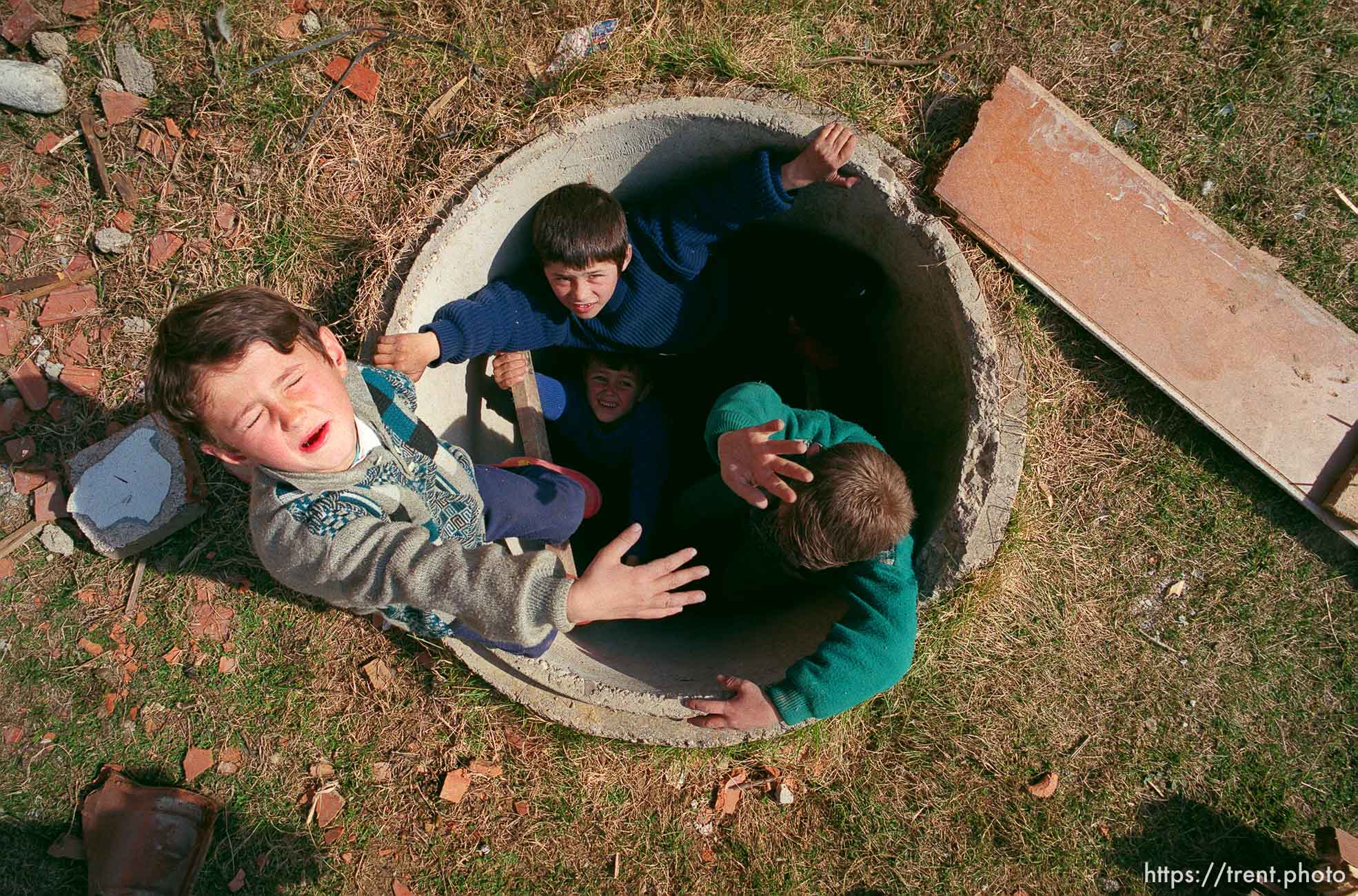 Kids in a pipe.