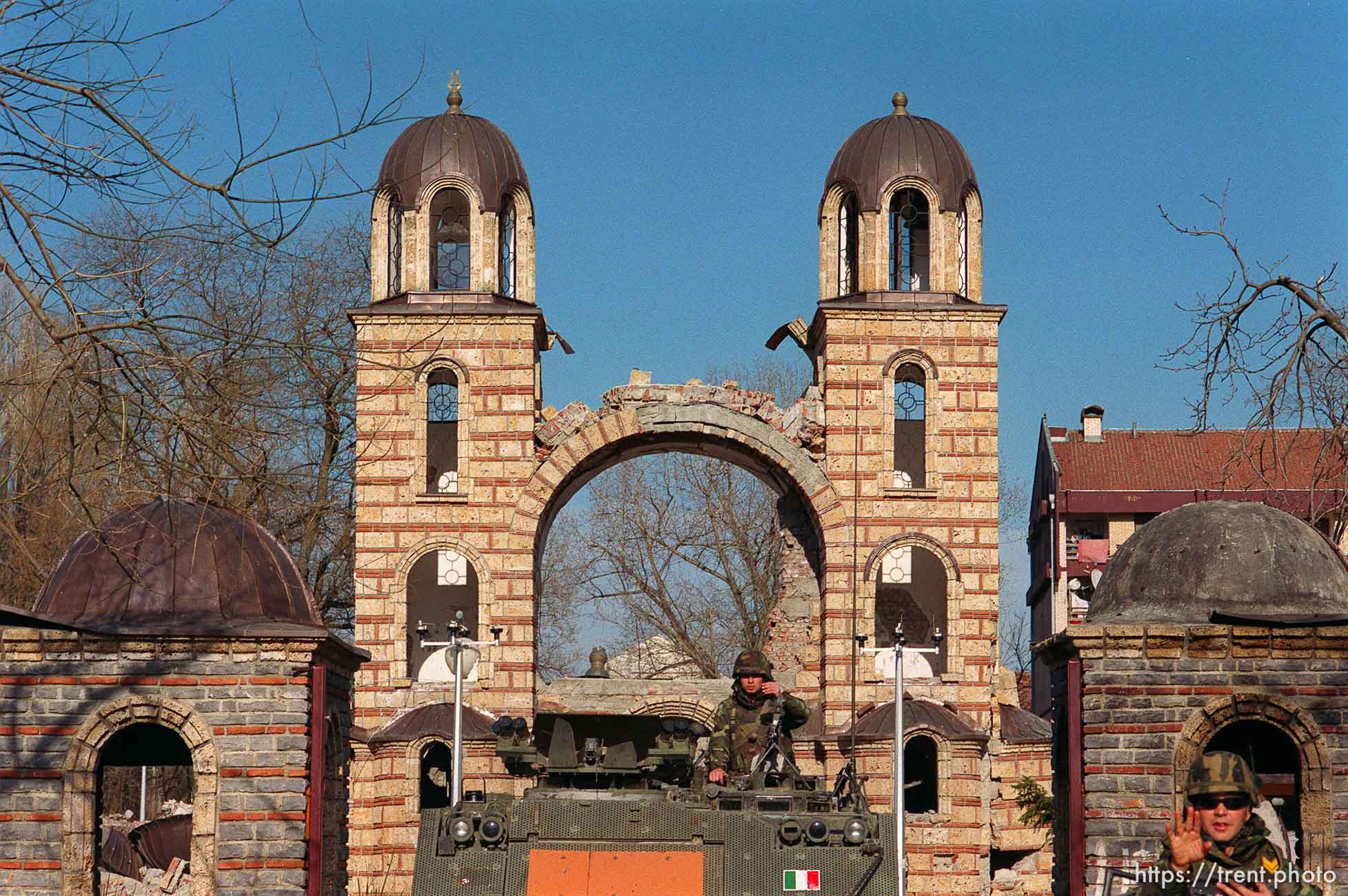 KFOR troops guarding an orthodox church, one soldier trying to stop me.