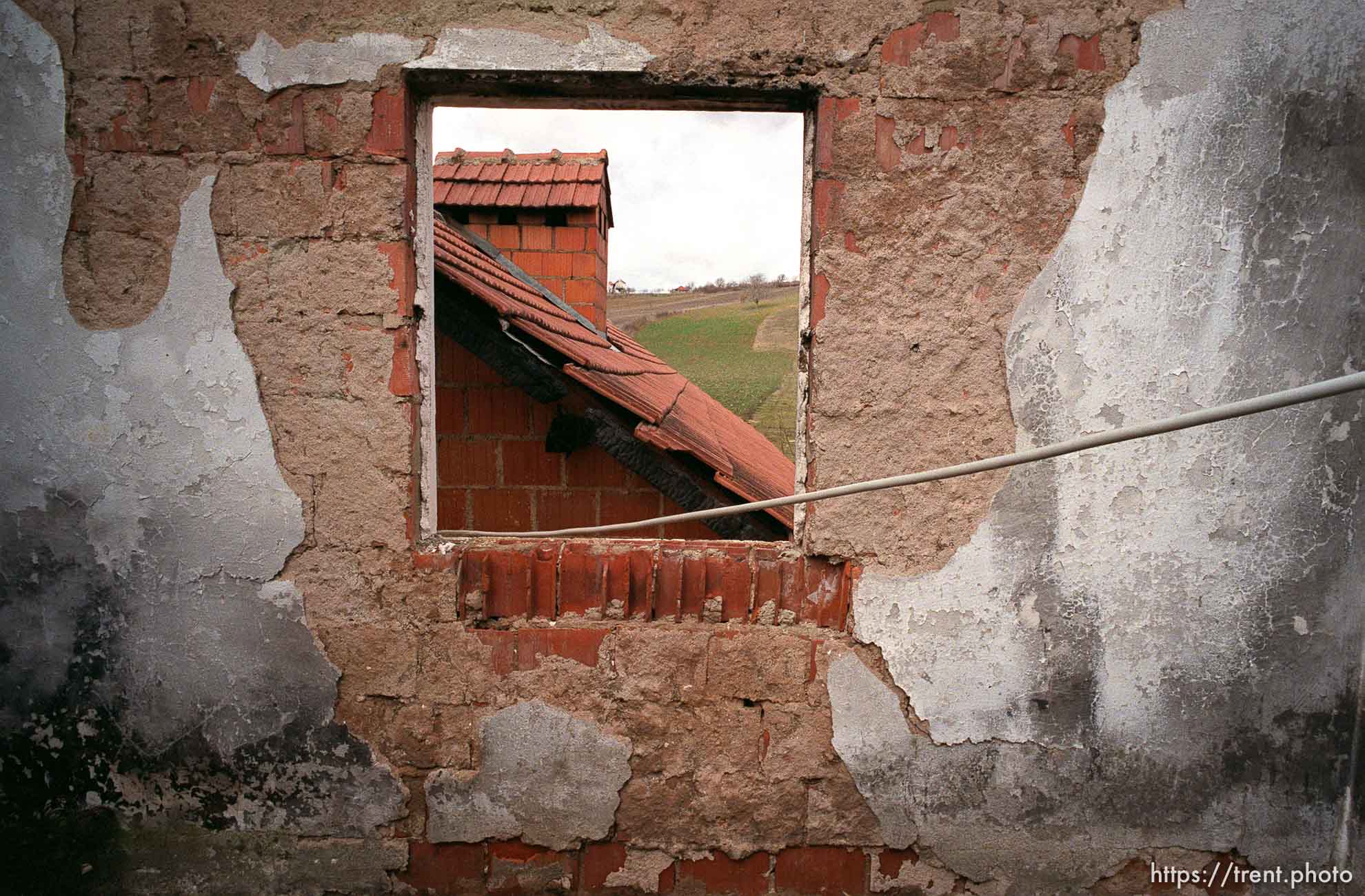 A view through the ruins of Anton Selitaj's home, destroyed by Serbs.