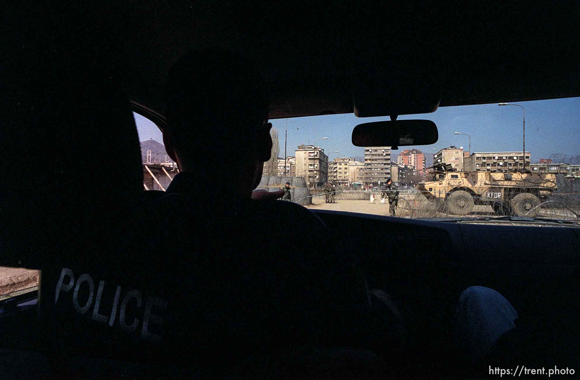 UNMIK police officer Zane Smith drives to the north, Serbian side of Mitrovica across the main bridge.