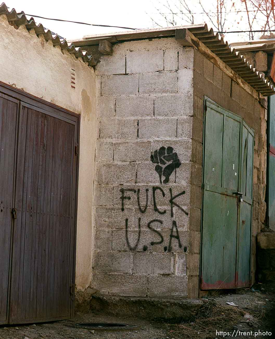 FUCK USA and black fist graffiti in North Mitrovica