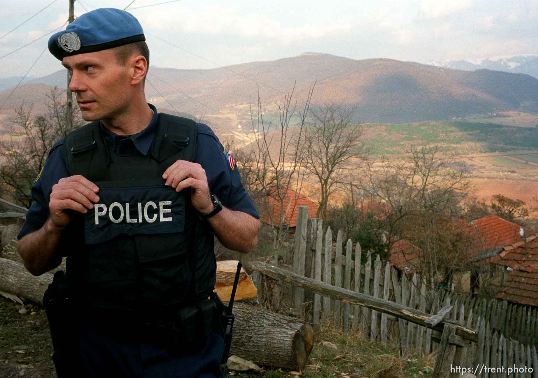 UNMIK police officer Zane Smith working on a homicide case in a hillside village in Northern Kosovo