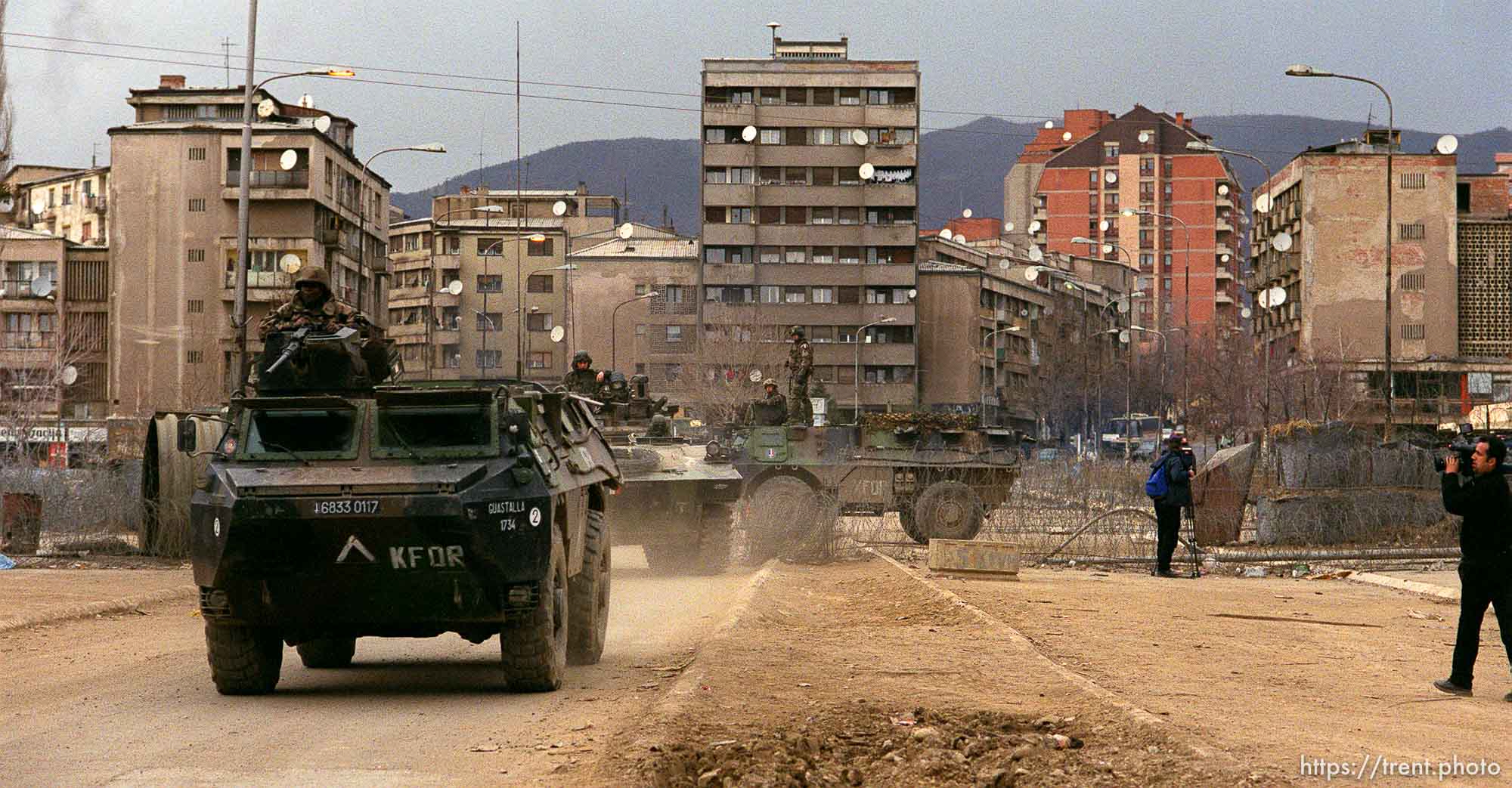 KFOR troops on the main bridge seperating North (Serb) and South (Albanian) Mitrovica. This is looking north.